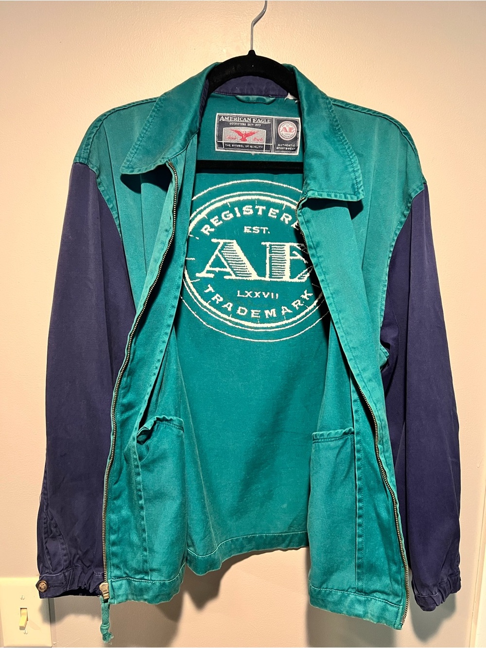 American Eagle Outfitters Teal zip-up with White Logo